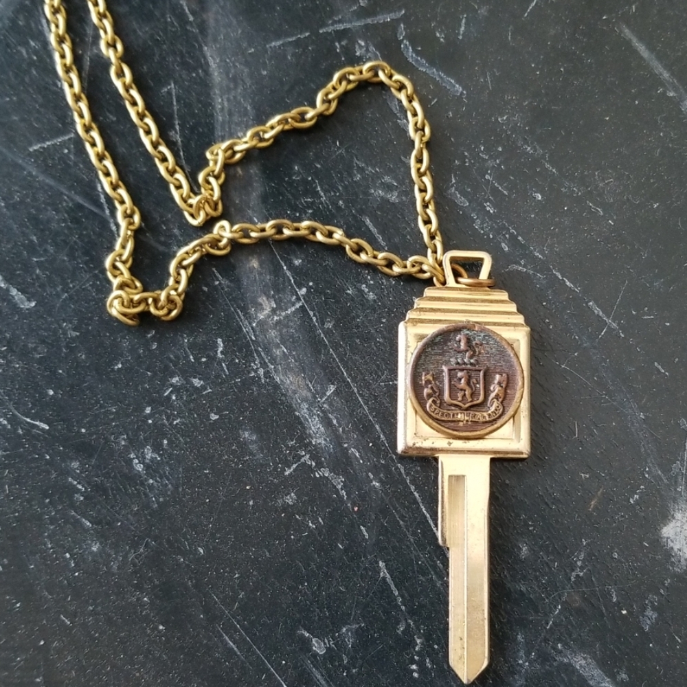 Vintage coat of  arms faux gold key necklace